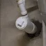 Water leaking around basement pipe penetration in a concrete foundation wall